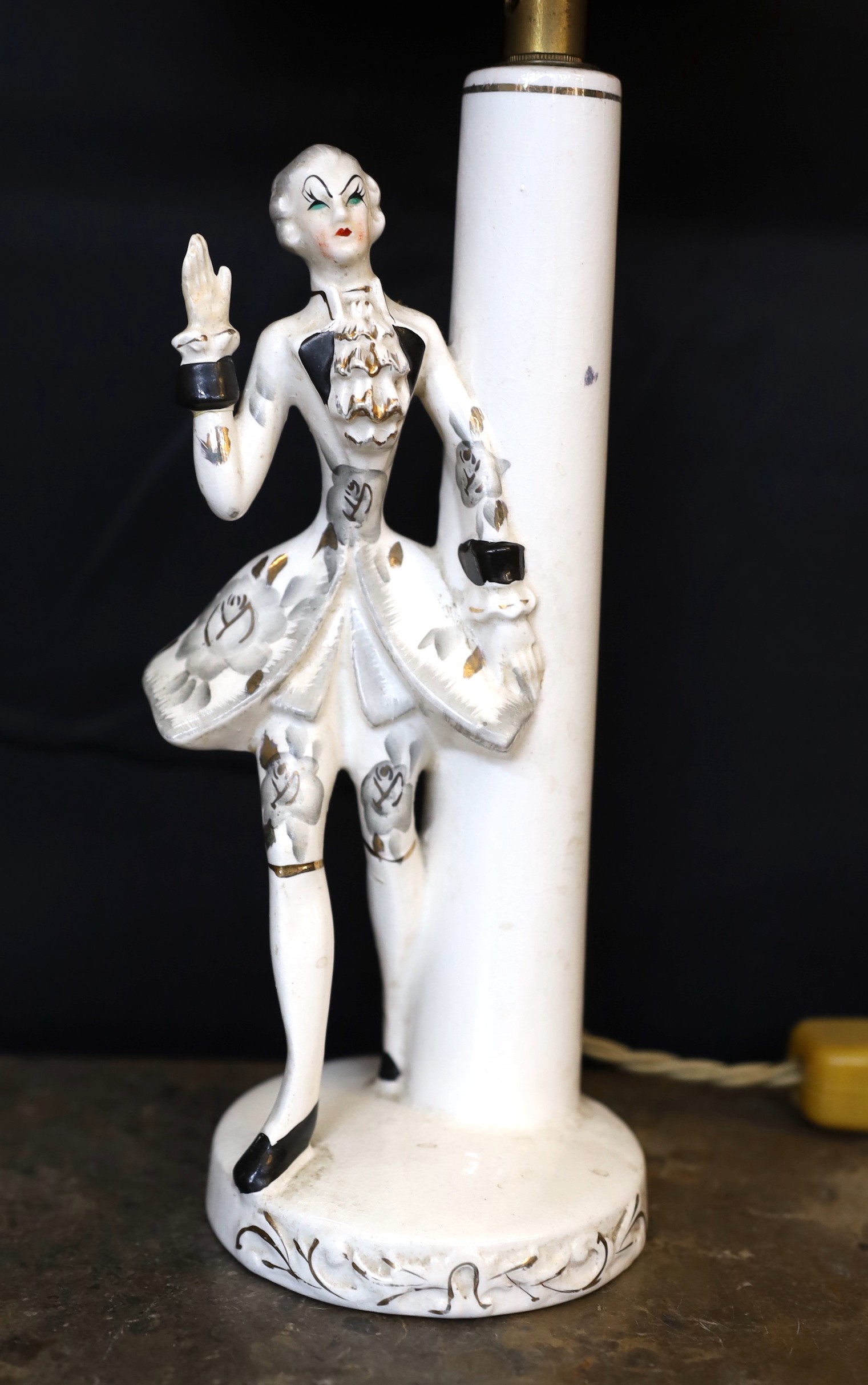 A 1950s German ceramic table lamp modelled with a gallant, height 30cm.